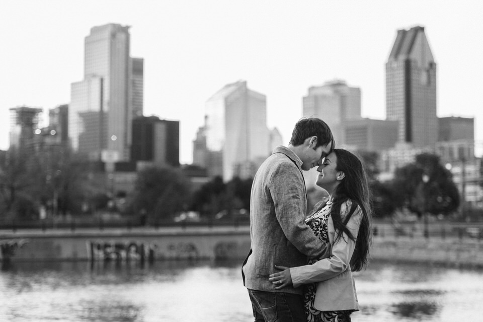Engagement photo with skyline of downtown Montreal