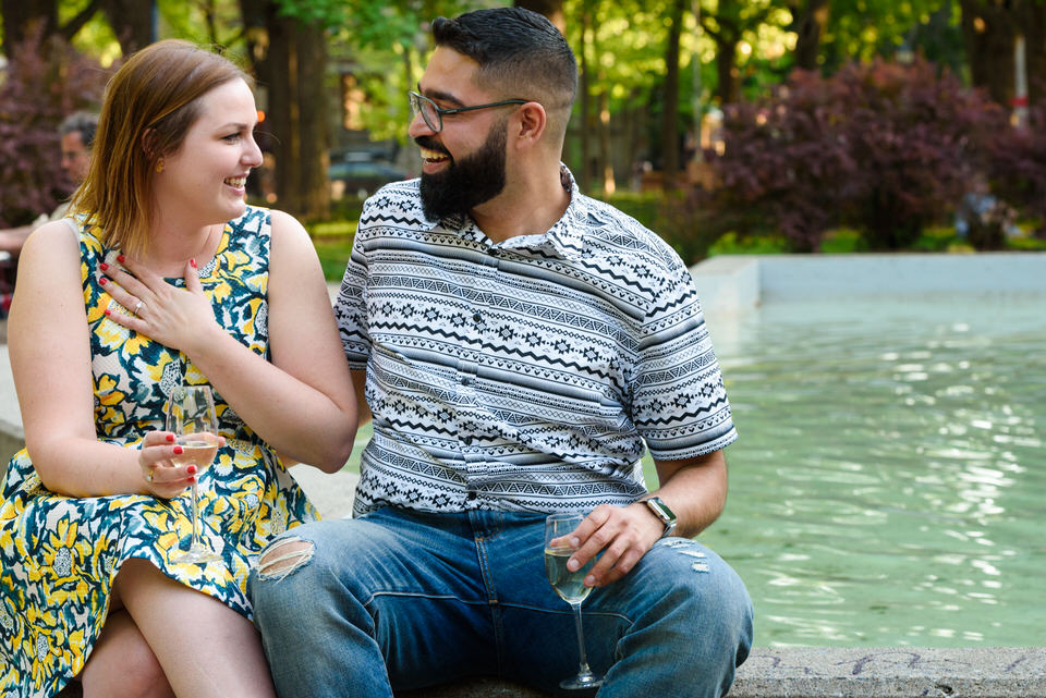 Woman with hand on heart looking at her new fiancé