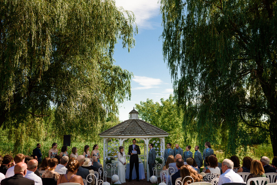 Outdoor wedding ceremony in front of gazebo at Auberge des Gallant