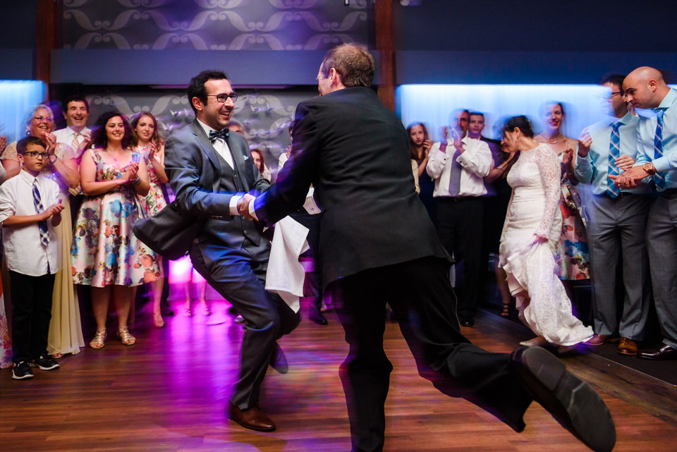 Groom spinning with his father during the hora