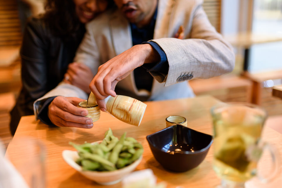 Couple pouring sake