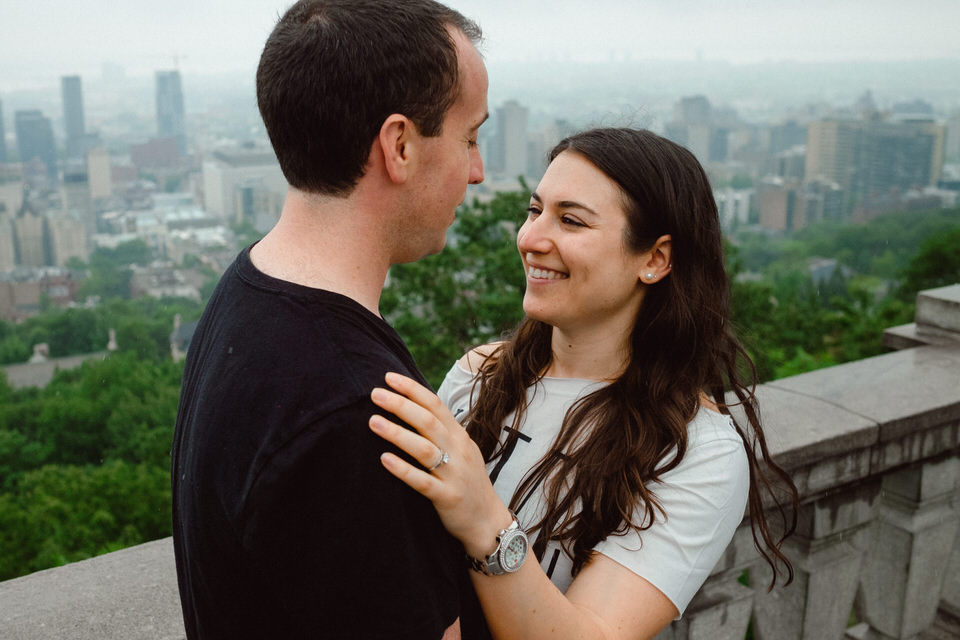 Engaged couple hugging at the Montreal lookout