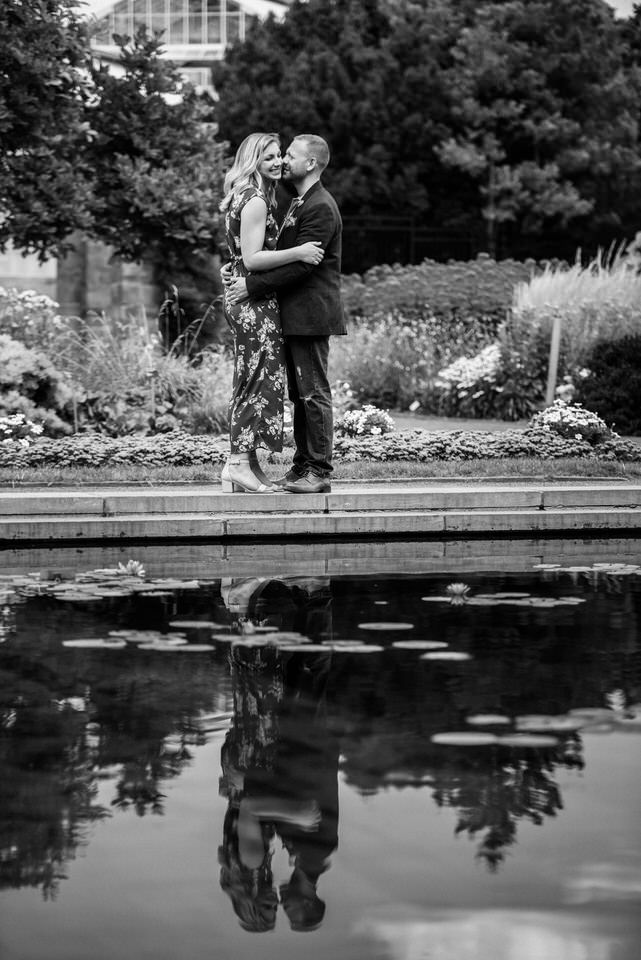Reflection of a couple in a pond 