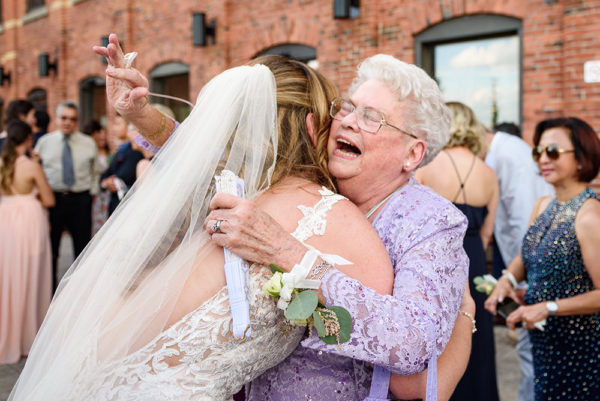Grandmother hugging the bride