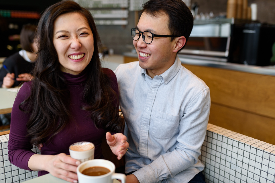 Laughing coffeeshop engagement photos in Old Montreal