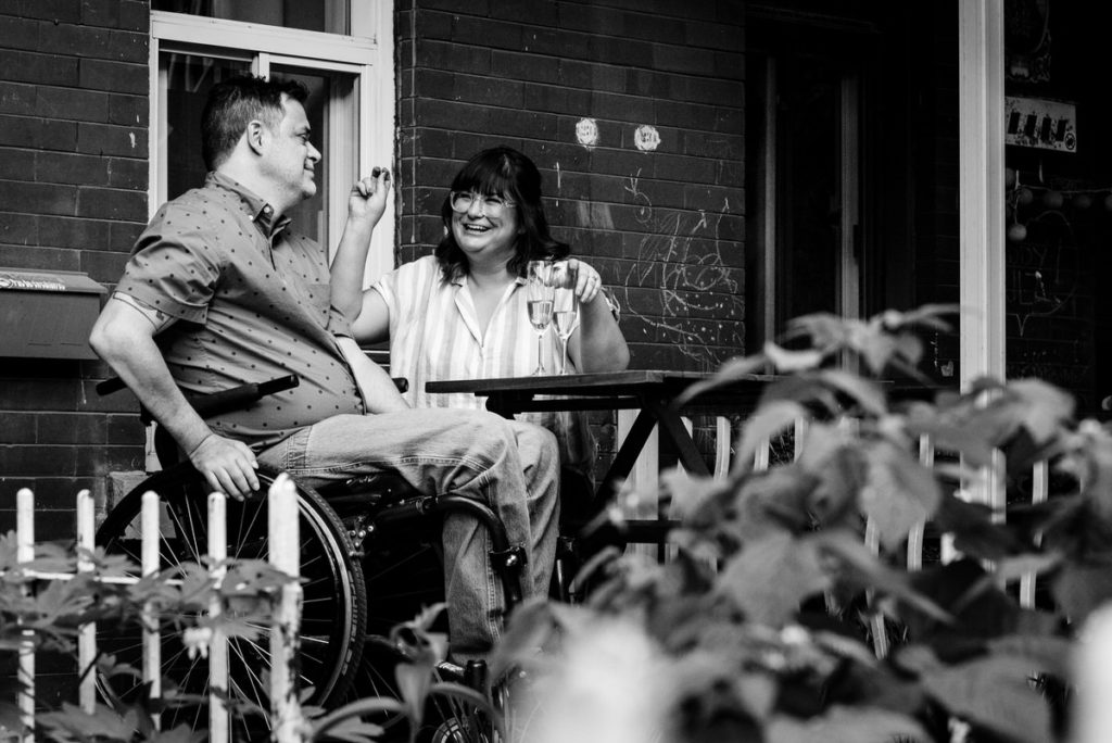 couple laughing and smiling on porch